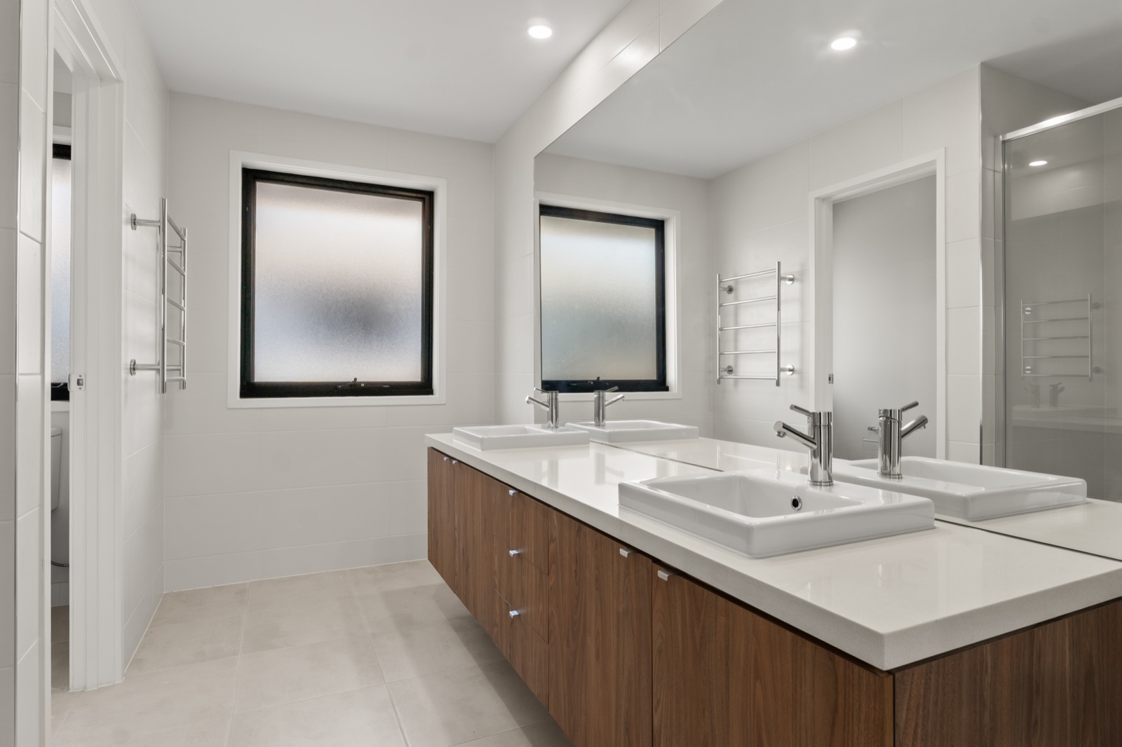 Family bathroom with a freestanding bath and stone tiling