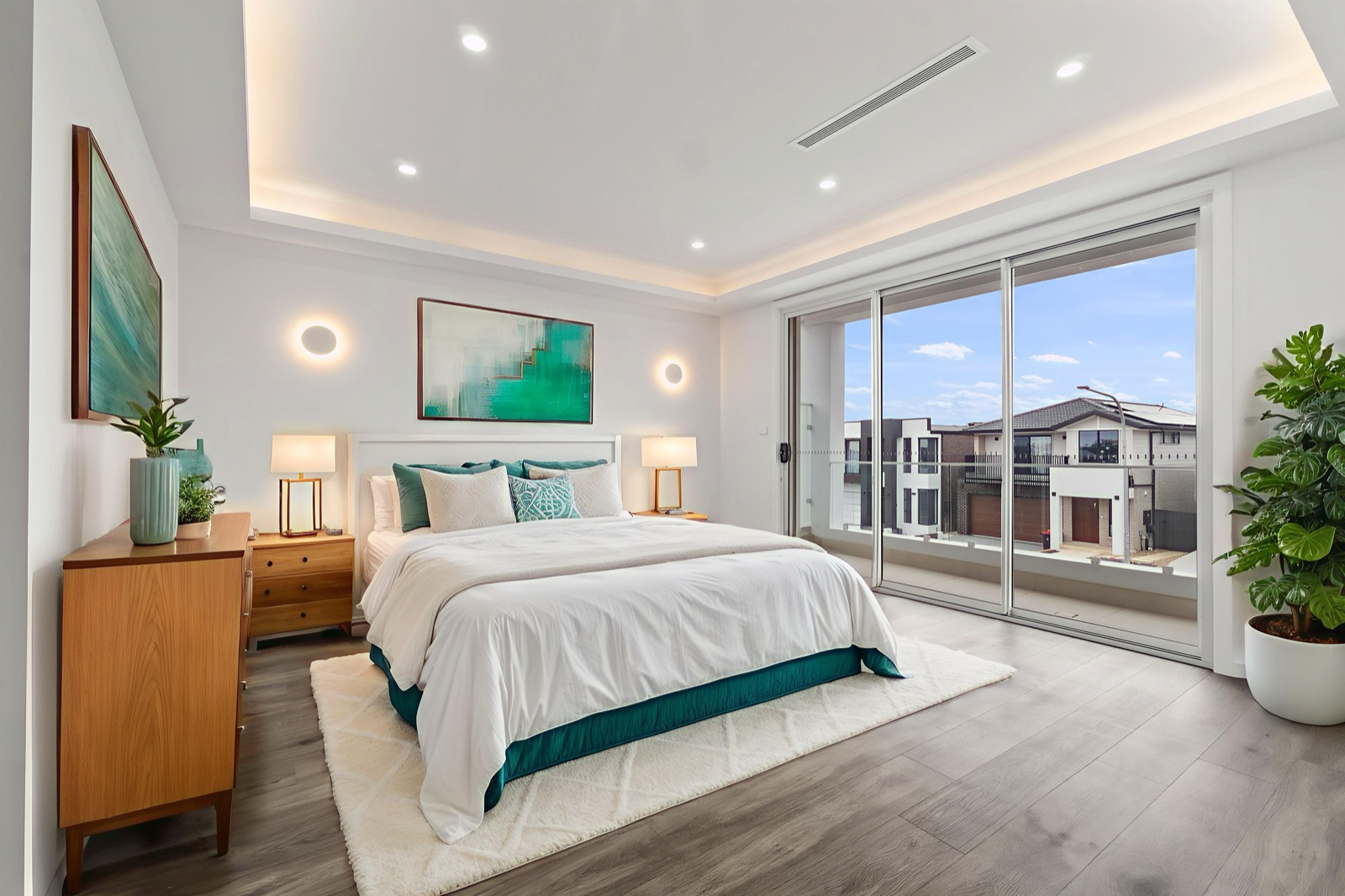 Master bedroom styled with neutral furnishings and soft natural light